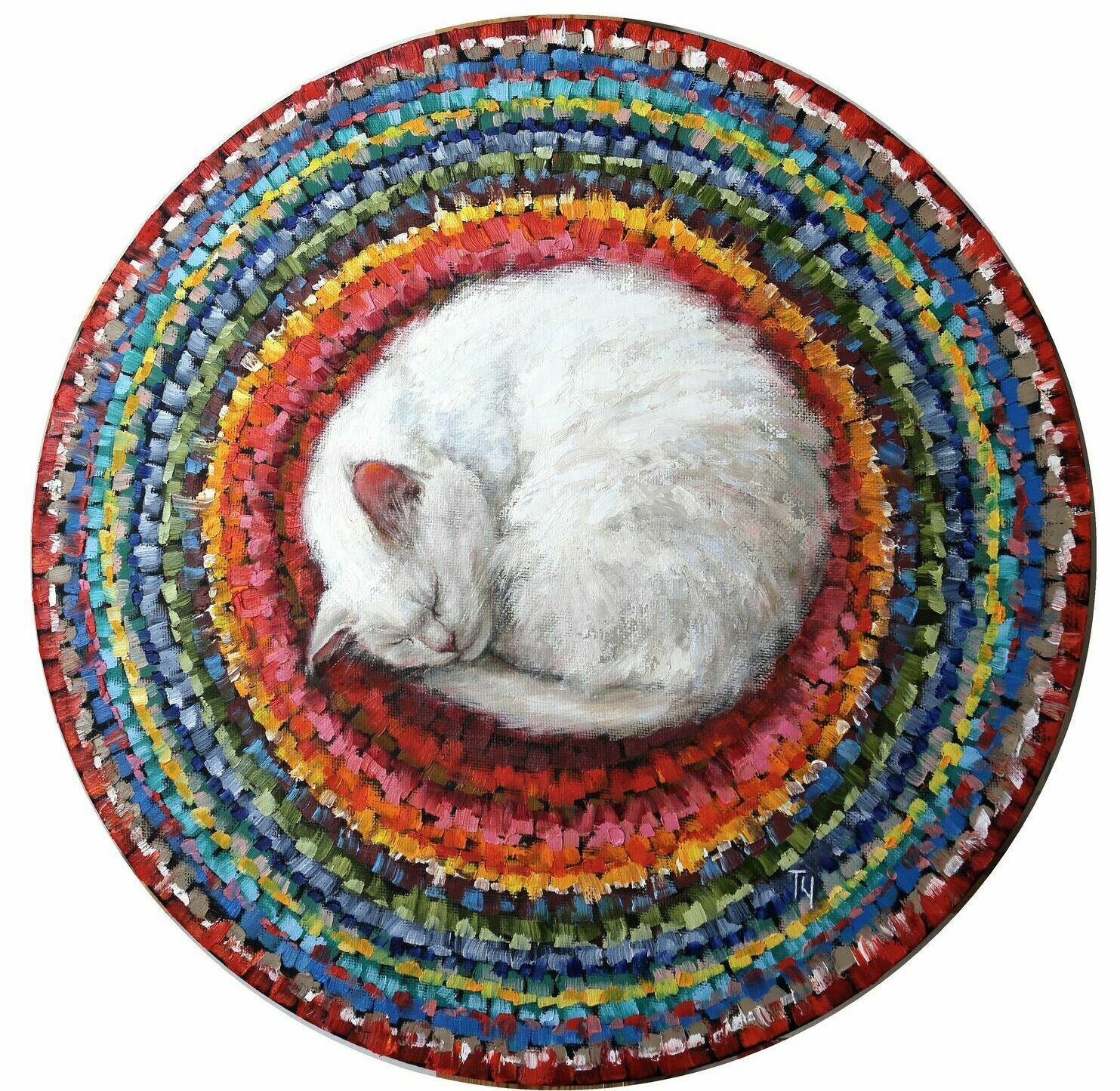 кошка на круглом коврике