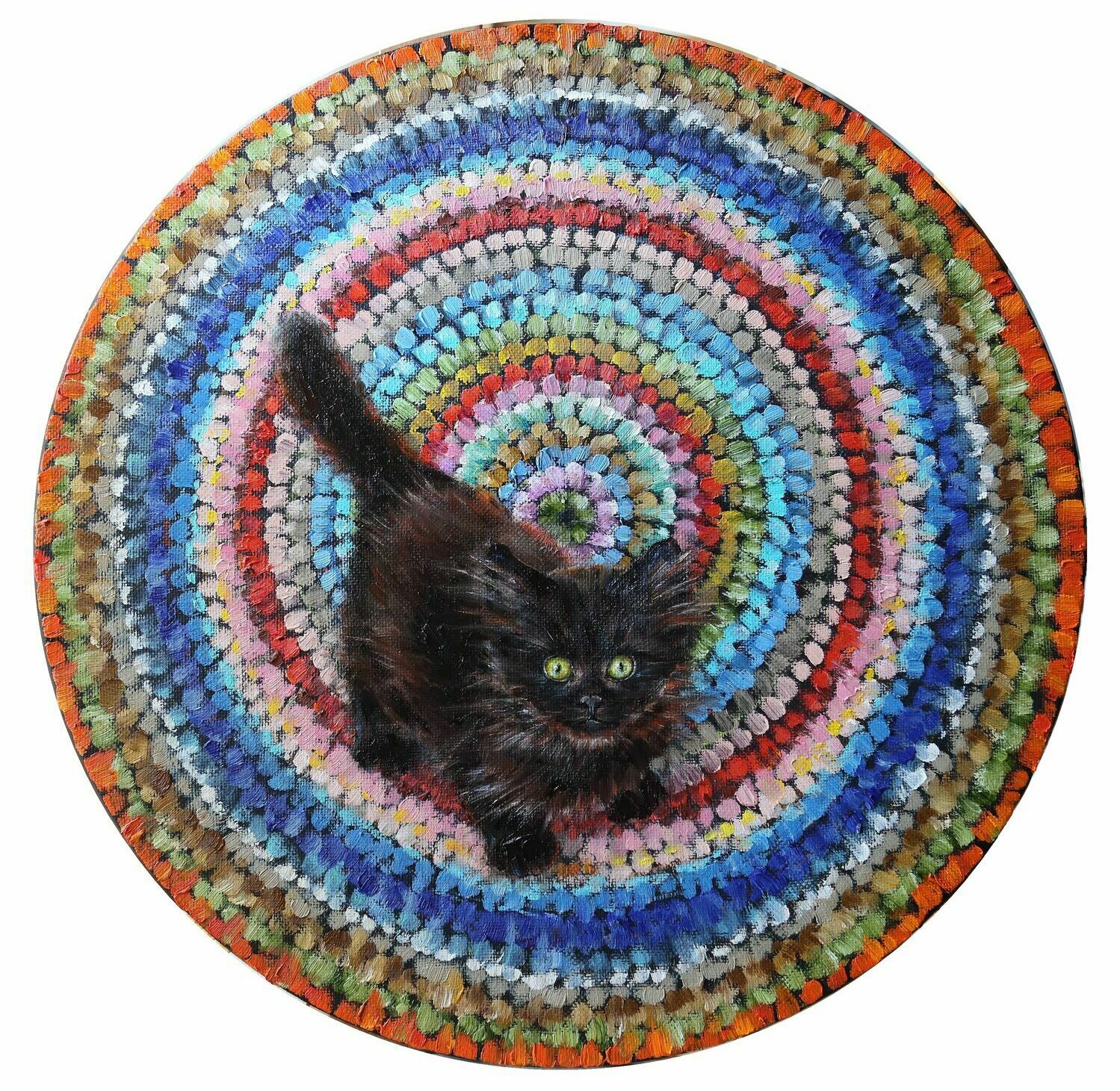 котенок на круглом коврике